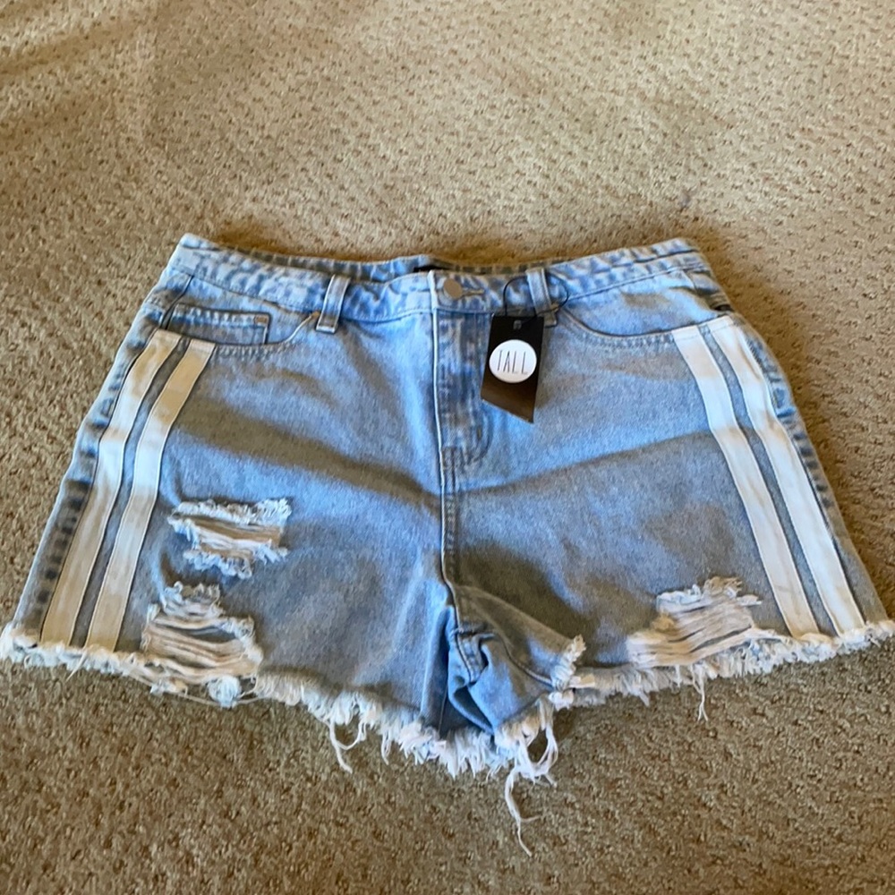 Distressed denim shorts with white sports stripe